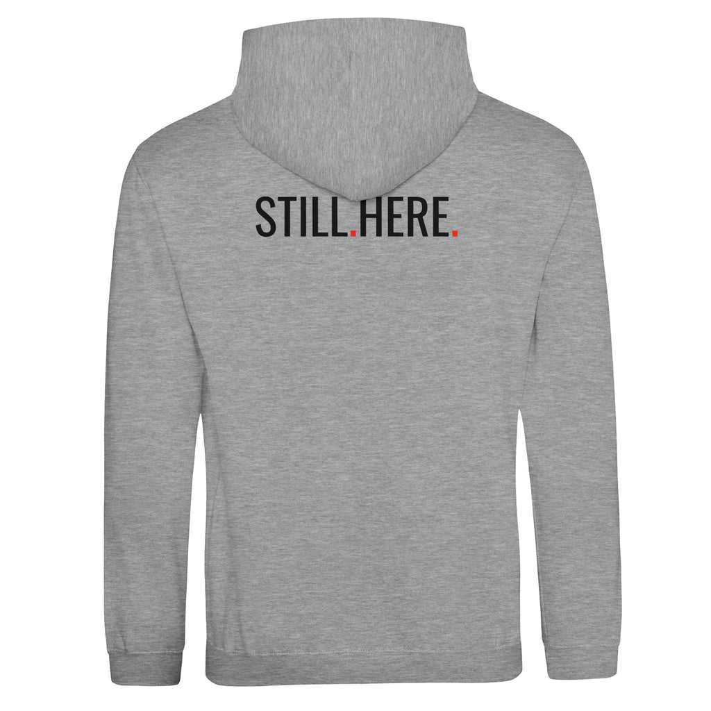 Gray hoodie with 'STILL.HERE.' text on the back against a white background