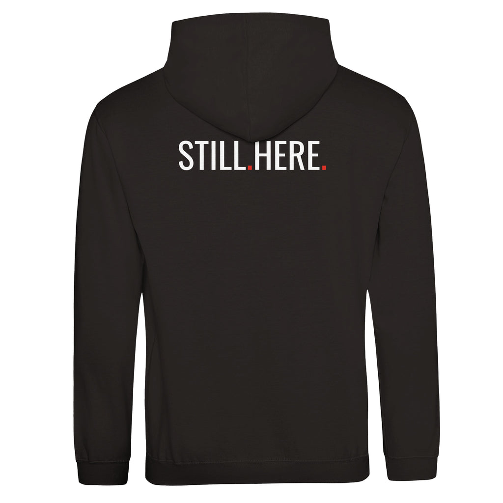 Black hoodie with 'STILL.HERE.' text on the back against a white background